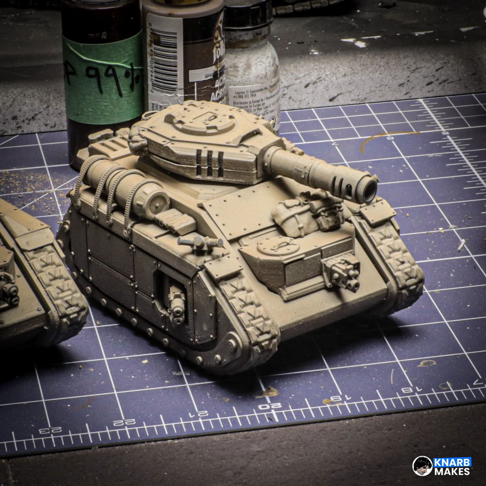 The real assembled Battleborn tank on the workshop cutting mat, with added kitbash weapons and accessories